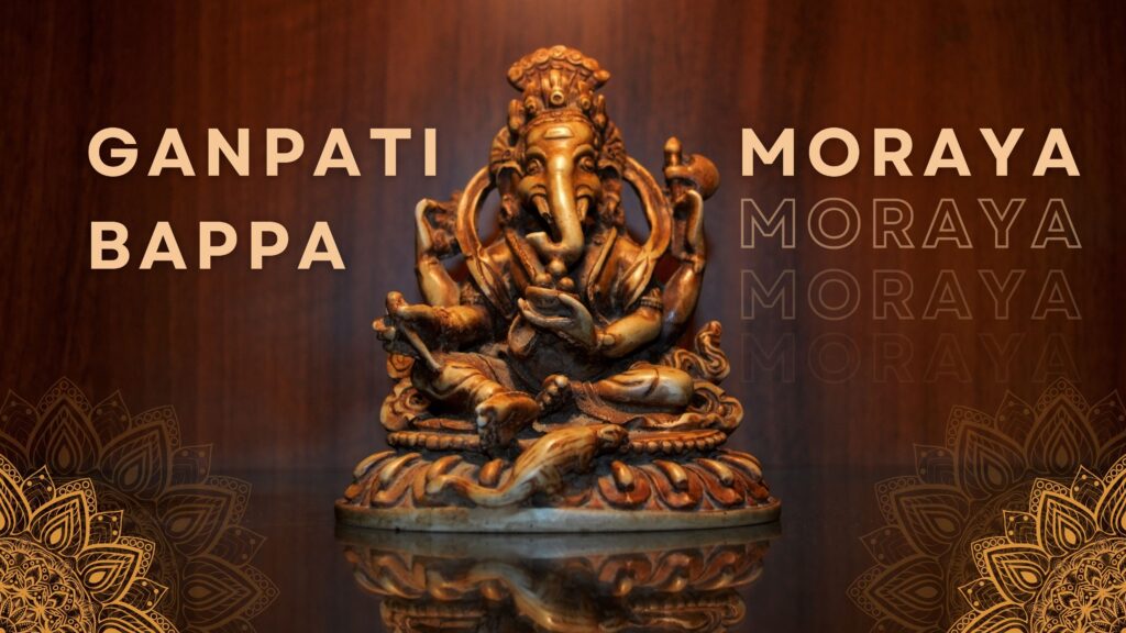 ganesh ji beautiful golden statue with the text ganpati bappa moraya