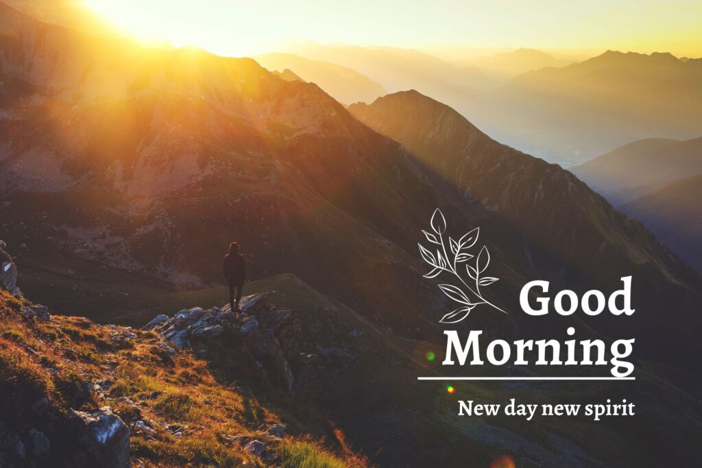 a men standing on the mountain watching the sunrise from the mountains- good morning image