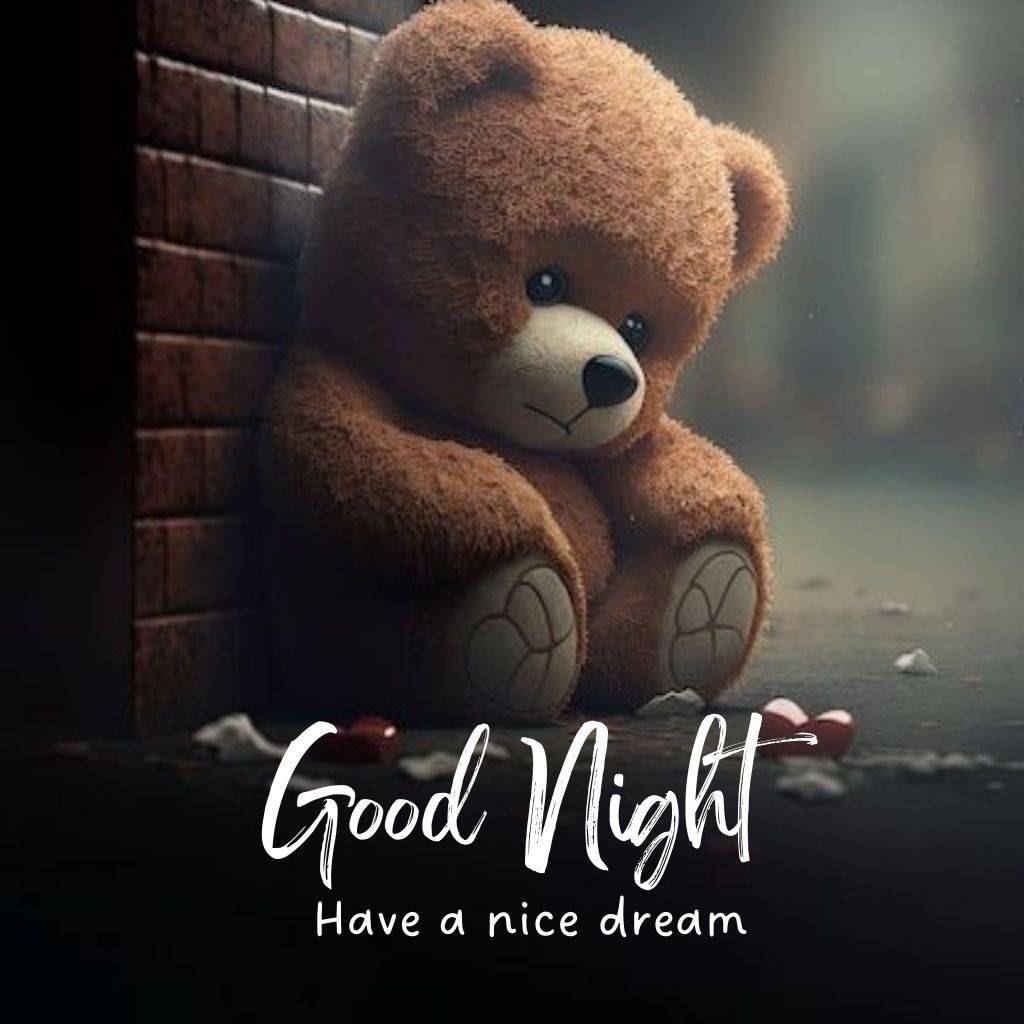 A sad cute bear soft toy in the dark street with a good night text