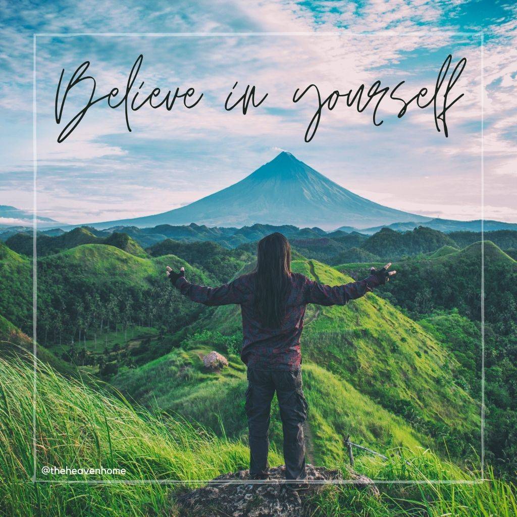 a girl standing on the mountains image with a motivational quote