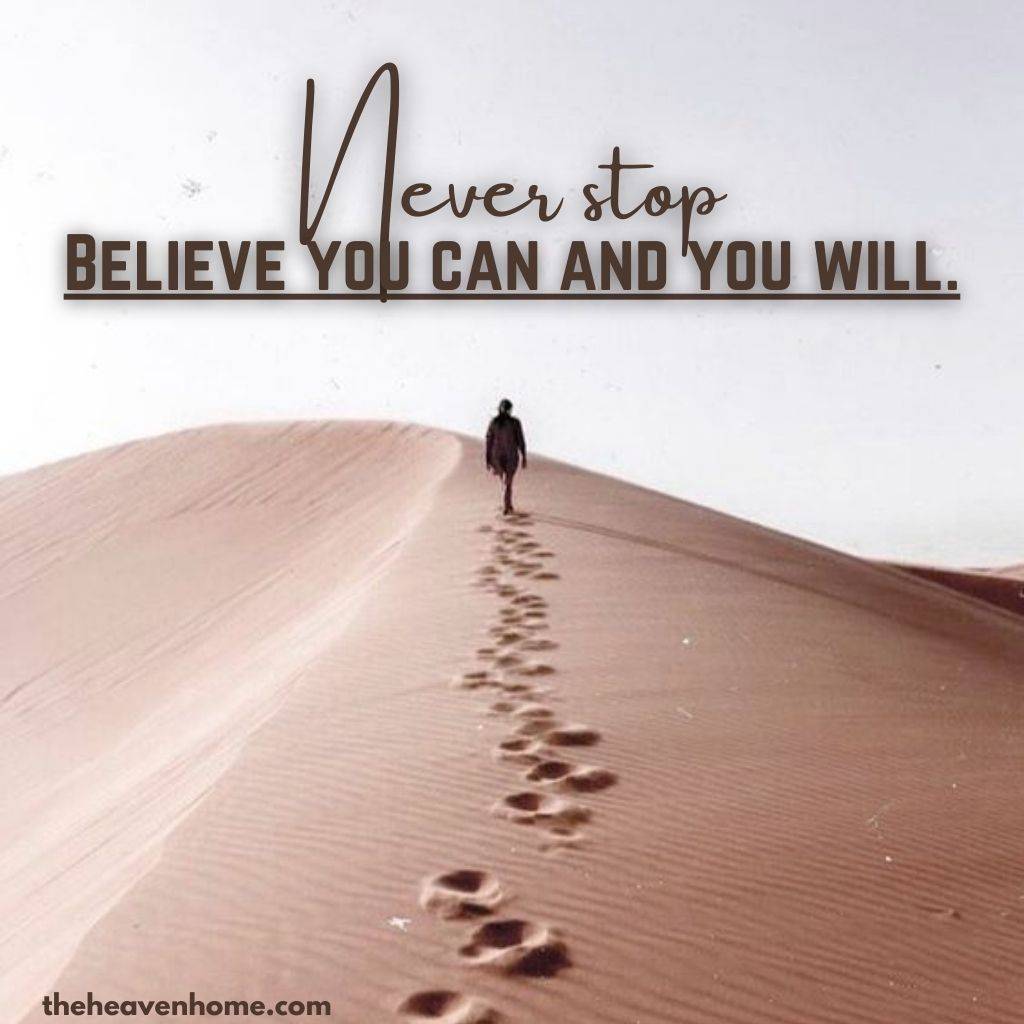 a men walking in a desert with a motivational quote